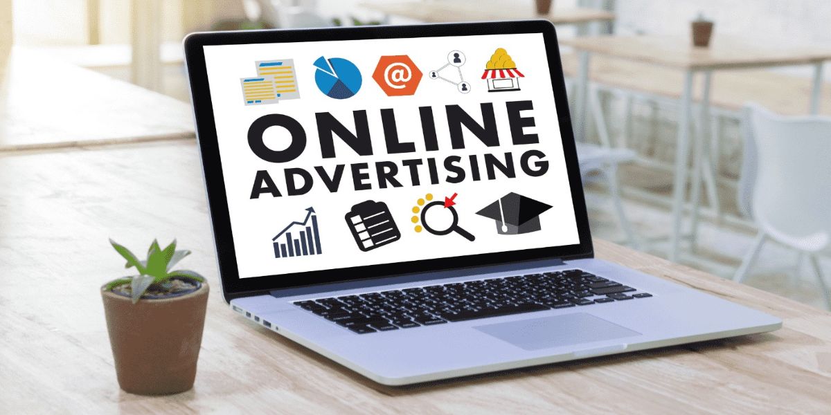 Laptop screen displaying "Online Advertising" with various marketing icons.